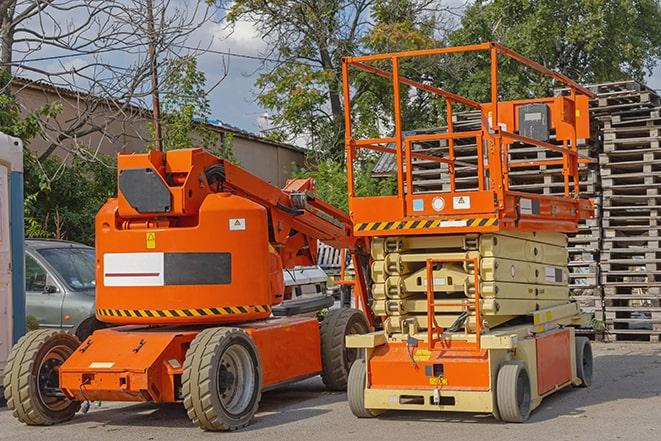 forklift carrying pallets in a warehouse in Berkeley Lake GA